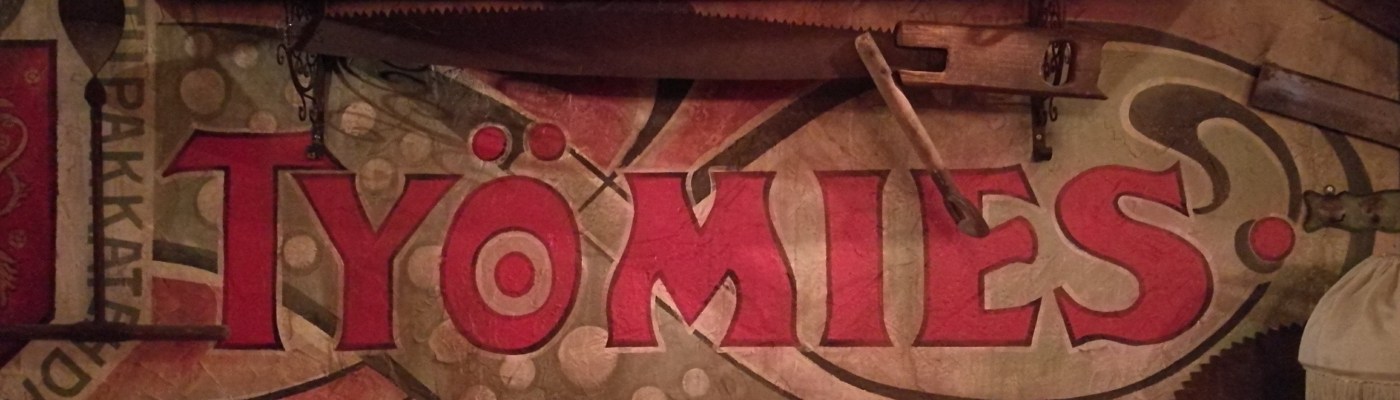 Työmies -tupakka-askin logo Huutokonttorin seinällä